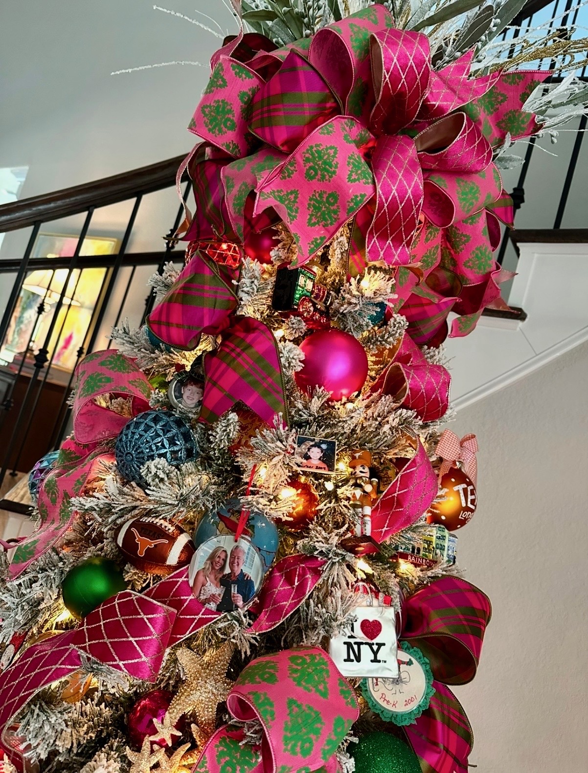 Flocked tree with family photo ornaments